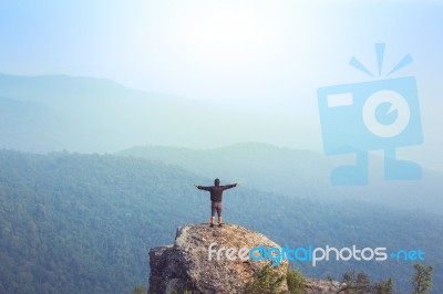 Instagram Filter Young Man Asia Tourist At Mountain Is Watching Over The Misty And Foggy Morning Sunrise, Travel Trekking Stock Photo