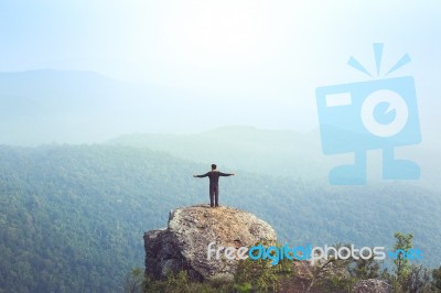 Instagram Filter Young Man Asia Tourist At Mountain Is Watching Over The Misty And Foggy Morning Sunrise, Travel Trekking Stock Photo