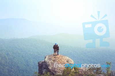 Instagram Filter Young Man Asia Tourist At Mountain Is Watching Over The Misty And Foggy Morning Sunrise, Travel Trekking Stock Photo