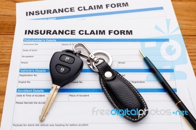 Insurance Claim Form With Car Key Stock Photo