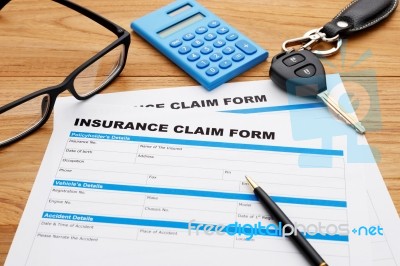 Insurance Claim Form With Car Key Stock Photo