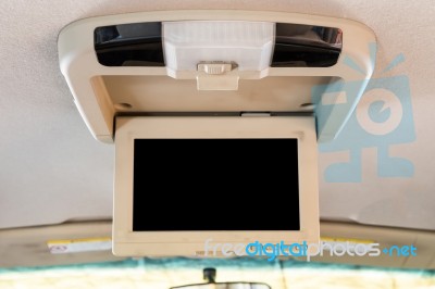 Interior Detail Of Modern Luxury Car Dashboard With Big Display And Light Button Switch On Ceiling. Screen Multimedia System Stock Photo