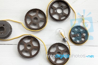 Interlocking Industrial  Cogwheels Top View On Black Background Stock Photo