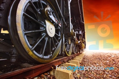 Iron Wheels Of Stream Engine Locomotive Train On Railways Track Stock Photo