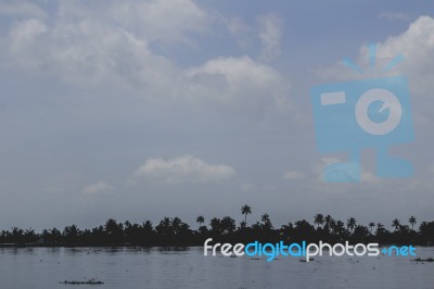 Island With Blue Sky And Water Stock Photo
