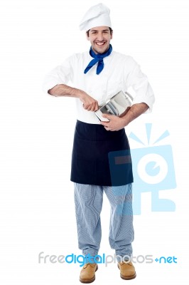 Isolated Chef Posing With Utensil Stock Photo
