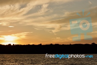 Isolated Picture With An Amazing Sunset On A Lake Stock Photo