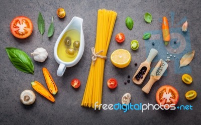 Italian Food And Menu Concept Spaghetti With Ingredients On Dark… Stock Photo Italian Food And Menu Concept Spaghetti With Ingredients On Dark… Stock Photo