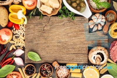 Italian Food Cooking Ingredients On Dark Stone Background With C… Stock Photo