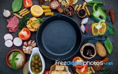 Italian Food Cooking Ingredients On Dark Stone Background With I… Stock Photo