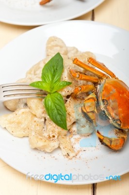 Italian Gnocchi With Seafood Sauce With Crab And Basil Stock Photo