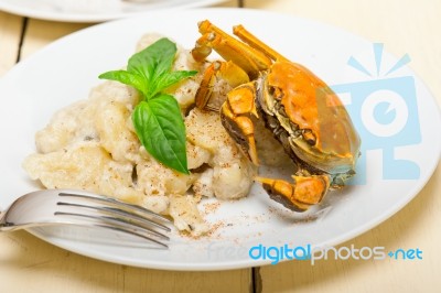 Italian Gnocchi With Seafood Sauce With Crab And Basil Stock Photo