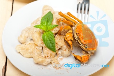 Italian Gnocchi With Seafood Sauce With Crab And Basil Stock Photo