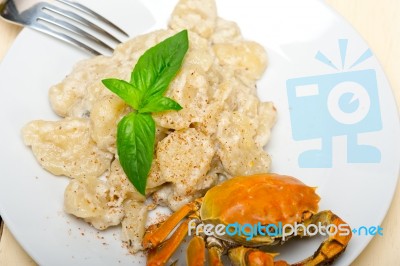 Italian Gnocchi With Seafood Sauce With Crab And Basil Stock Photo