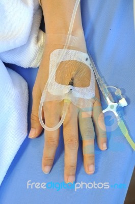 IV Solution In Patients Hand Stock Photo