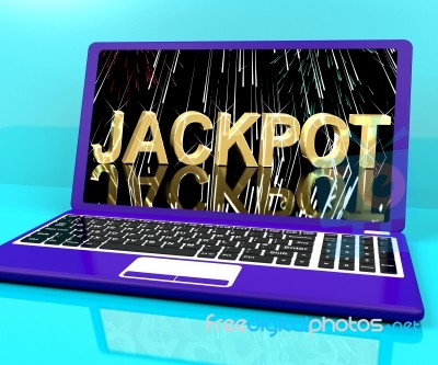 Jackpot Word With Fireworks On Laptop Showing Winning Stock Image