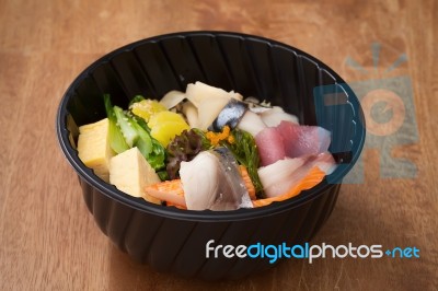 Japanese Food Tekka Don Take Away On Wooden Background Stock Photo