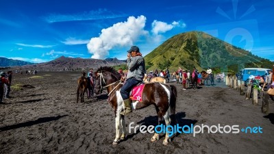 Java,indonesia-arpil 24,2017 : A Horseman At Mount Bromo Of Bromo-tengger-semeru National Park In Indonesia Stock Photo