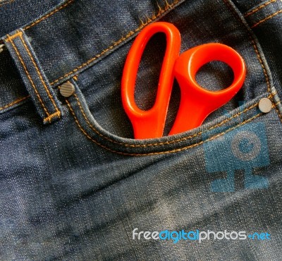Jeans With Scissors Stock Photo