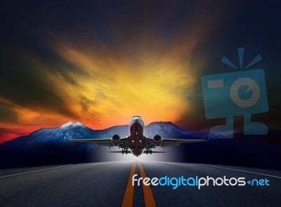 Jet Plane Flying Over Runways Against Rock Mountain And Beautifu… Stock Photo