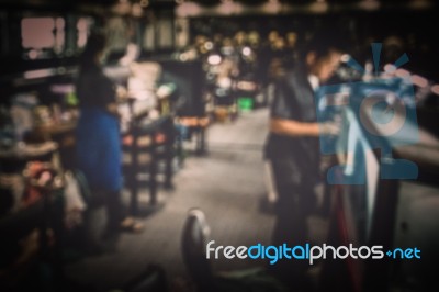 Jewelry Factory With Blurred Workers Background Stock Photo