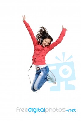 Jumping Youngster With Headphone Stock Photo