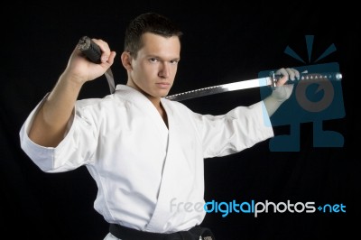 Karate Man With Katanas In Studio Stock Photo Karate Man With Katanas In Studio Stock Photo