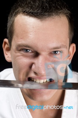 Karate, Sword In His Mouth Stock Photo