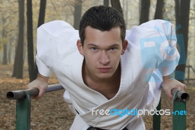 Karate Training In Autumn Forest Stock Photo