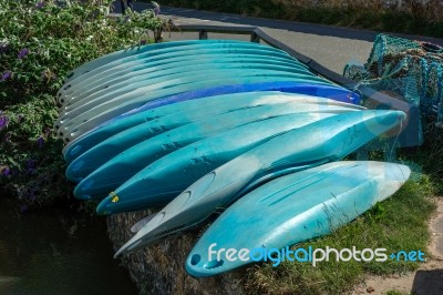 Kayaks Stacked At Bude Stock Photo