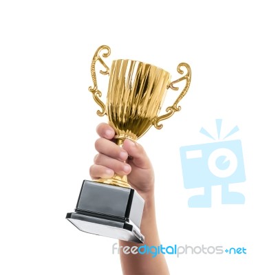 Kid Holding The Golden Trophy Stock Photo