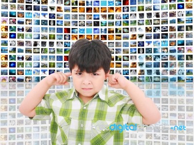 Kid Protecting Ears From Noise Stock Photo