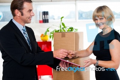 Kindly Sign The Business Papers Ma'am! Stock Photo