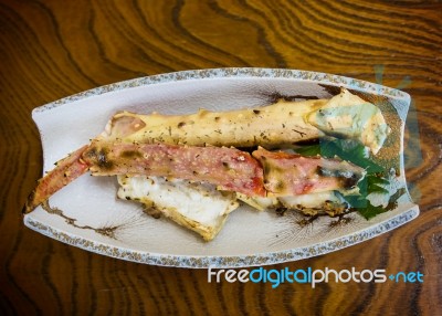King Crab Leg On Wooden Table Stock Photo