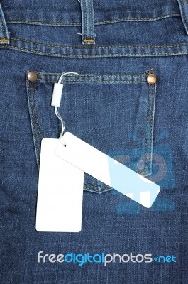 Label Tied To Blue Jeans Stock Photo
