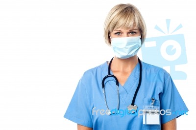 Lady Doctor Wearing Surgical Mask Stock Photo