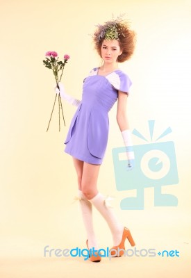 Lady In Purple Dress With Flowers Stock Photo