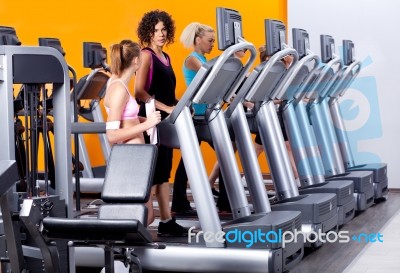 Lady Instructor In Gym Stock Photo