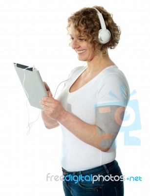 Lady Listening Music On Tablet Pc Stock Photo