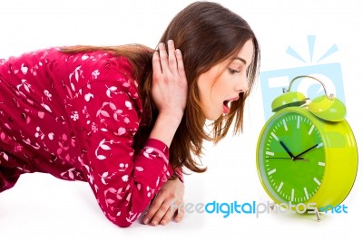 Lady Looking At Alarm Clock Stock Photo