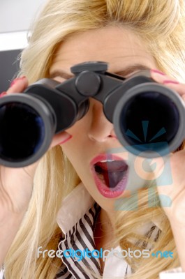 lady looking through Binocular Stock Photo