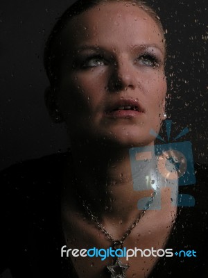 lady looking up behind the mirror Stock Photo