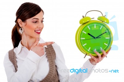 Lady Pointing At Alarm Clock Stock Photo