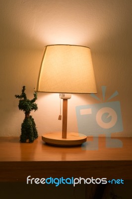 Lamp On The Desk With Reindeer Tree Decoration Stock Photo
