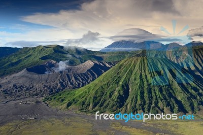 Landscape Of Lenticular Cloud On Top Of Volcanoes In Bromo Mount… Stock Photo