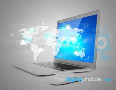 Laptop With Social Network On World Map Stock Photo