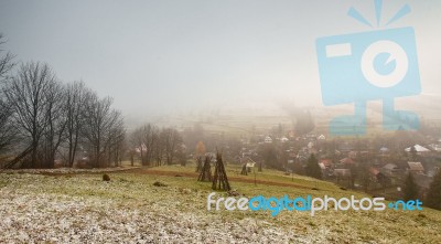 Late Autumn Misty Morning In A Village. First Snow Stock Photo