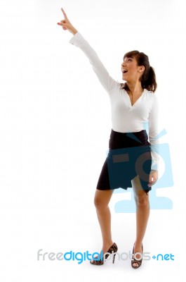 laughing Businesswoman Pointing Up Stock Photo