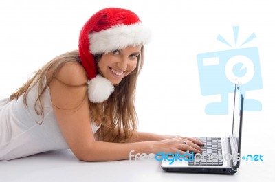Laying Female With Christmas Hat And Laptop Stock Photo