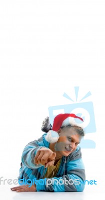 Laying Man With Christmas Hat Stock Photo